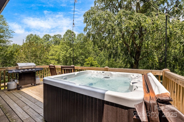 6541 Grassy Branch Rd, Bryson City, NC 28713 - deck with a hot tub, a grill, and a view of trees