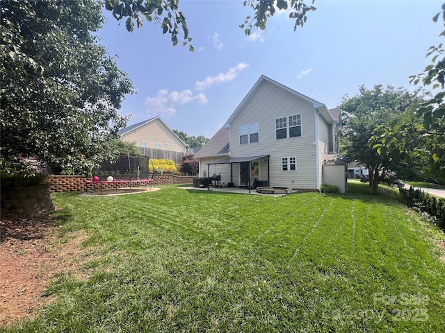 418 Eastway Ln SW, Conover, NC 28613 - rear view of property featuring a patio area and a trampoline