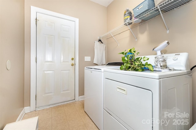 9814 Tompkins Ln, Waxhaw, NC 28173 - laundry room with washer and dryer and baseboards