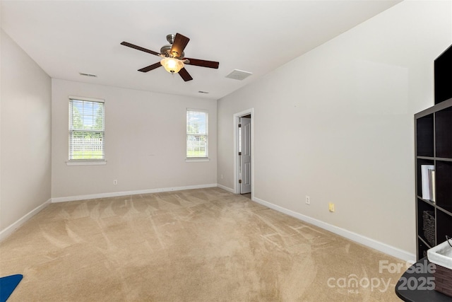 9814 Tompkins Ln, Waxhaw, NC 28173 - spare room featuring light colored carpet, ceiling fan, and baseboards