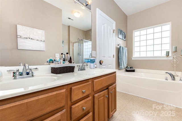 9814 Tompkins Ln, Waxhaw, NC 28173 - full bathroom featuring a bath, a stall shower, double vanity, and tile patterned flooring