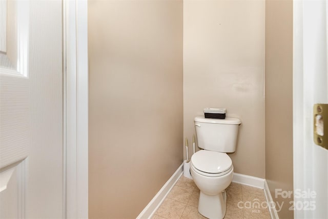 9814 Tompkins Ln, Waxhaw, NC 28173 - bathroom featuring toilet, tile patterned floors, and baseboards