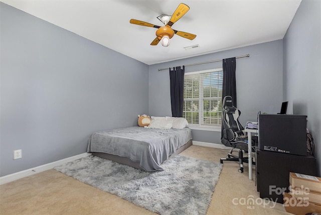 9814 Tompkins Ln, Waxhaw, NC 28173 - carpeted bedroom featuring baseboards, an office area, and a ceiling fan