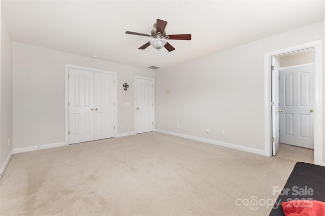 9814 Tompkins Ln, Waxhaw, NC 28173 - unfurnished bedroom with carpet, two closets, and baseboards