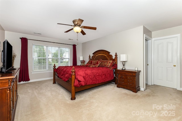 9814 Tompkins Ln, Waxhaw, NC 28173 - bedroom with light carpet, baseboards, and a ceiling fan