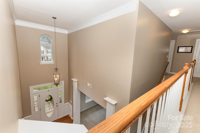 9814 Tompkins Ln, Waxhaw, NC 28173 - staircase featuring a chandelier and ornamental molding