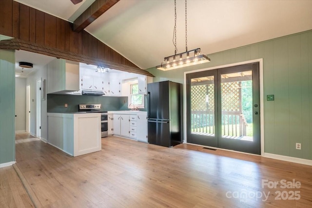 825 Pole Miller Ext, Brevard, NC 28712 - kitchen featuring stainless steel electric range oven, freestanding refrigerator, white cabinets, light wood-style floors, and vaulted ceiling