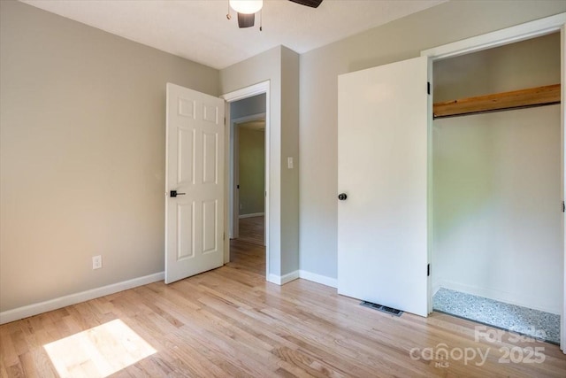 825 Pole Miller Ext, Brevard, NC 28712 - unfurnished bedroom with light wood-style flooring, baseboards, a closet, and a ceiling fan