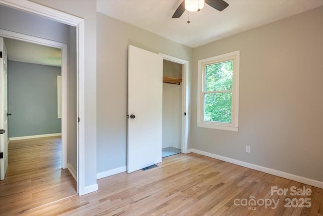 825 Pole Miller Ext, Brevard, NC 28712 - unfurnished bedroom featuring light wood-type flooring, baseboards, a closet, and ceiling fan