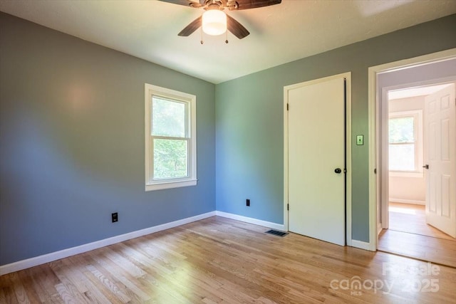 825 Pole Miller Ext, Brevard, NC 28712 - unfurnished bedroom featuring light wood-type flooring, baseboards, and ceiling fan