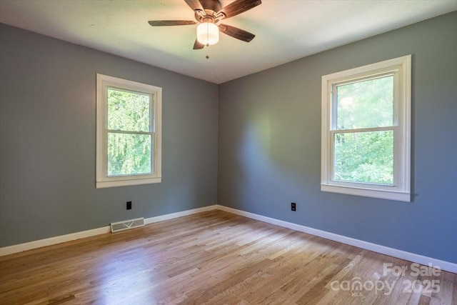 825 Pole Miller Ext, Brevard, NC 28712 - unfurnished room with baseboards, light wood finished floors, and ceiling fan
