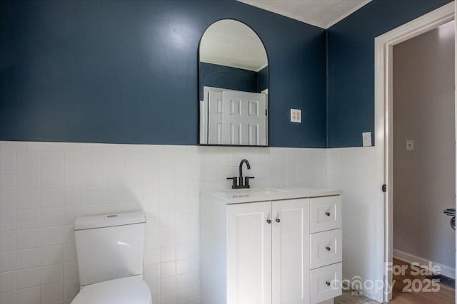 825 Pole Miller Ext, Brevard, NC 28712 - bathroom with tile walls, vanity, toilet, and wainscoting
