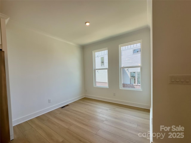 6013 Countess Dr Unit 51, Charlotte, NC 28217 - unfurnished room with ornamental molding, light wood-style flooring, and baseboards