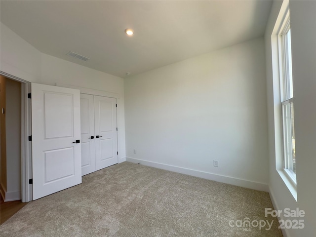 6013 Countess Dr Unit 51, Charlotte, NC 28217 - unfurnished bedroom featuring carpet, baseboards, and a closet