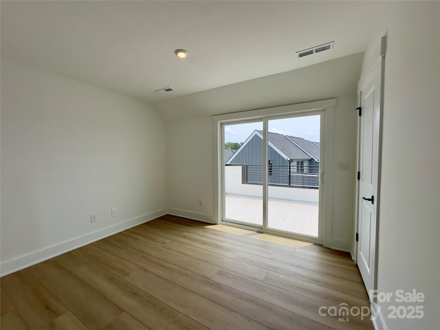 6013 Countess Dr Unit 51, Charlotte, NC 28217 - empty room with lofted ceiling, wood finished floors, and baseboards