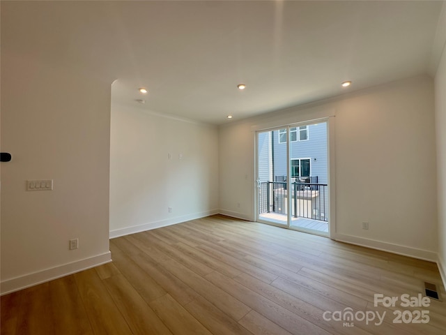 6013 Countess Dr Unit 51, Charlotte, NC 28217 - unfurnished room featuring wood finished floors, baseboards, recessed lighting, and crown molding