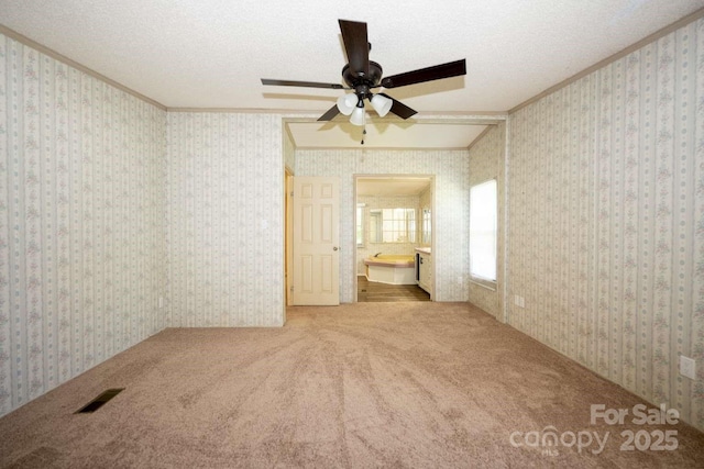 155 Springdale Acres Dr, Mooresville, NC 28115 - carpeted empty room with a ceiling fan, crown molding, and a textured ceiling