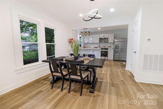 940 N New Hope Rd, Gastonia, NC 28054 - dining space with a chandelier, light wood-style floors, ornamental molding, baseboards, and recessed lighting