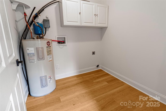 940 N New Hope Rd, Gastonia, NC 28054 - laundry room featuring electric water heater, cabinet space, light wood-style floors, baseboards, and hookup for a washing machine
