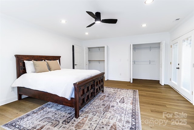940 N New Hope Rd, Gastonia, NC 28054 - bedroom with ornamental molding, multiple closets, wood finished floors, baseboards, and recessed lighting