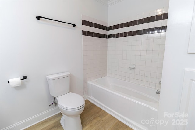 940 N New Hope Rd, Gastonia, NC 28054 - full bathroom with toilet, wood finished floors, shower / tub combination, and baseboards