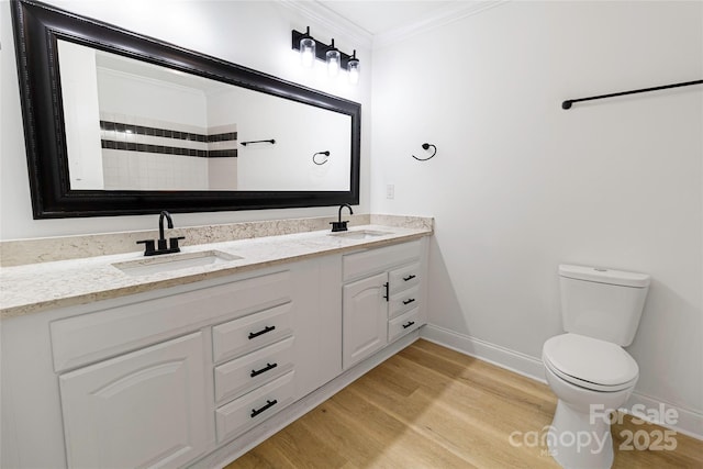 940 N New Hope Rd, Gastonia, NC 28054 - bathroom with double vanity, crown molding, toilet, wood finished floors, and baseboards