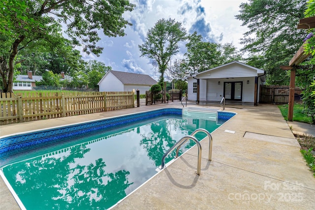 940 N New Hope Rd, Gastonia, NC 28054 - view of pool featuring french doors, an exterior structure, an outdoor structure, a patio, and a fenced backyard