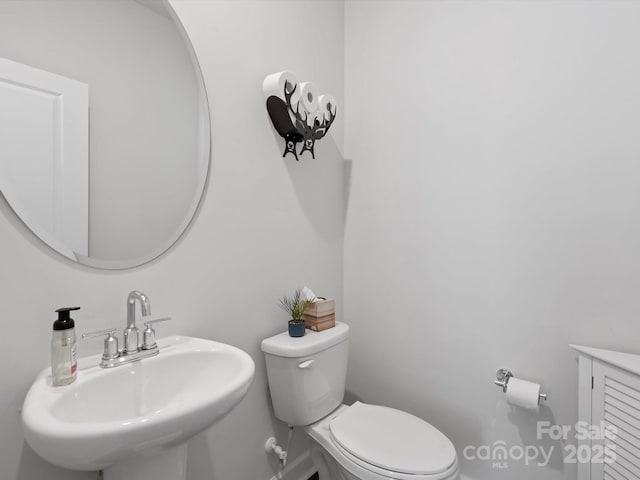 518 Palmarosa St, Fort Mill, SC 29715 - bathroom with toilet, a sink, and baseboards