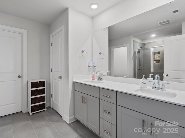 518 Palmarosa St, Fort Mill, SC 29715 - bathroom featuring double vanity, a stall shower, tile patterned floors, baseboards, and recessed lighting