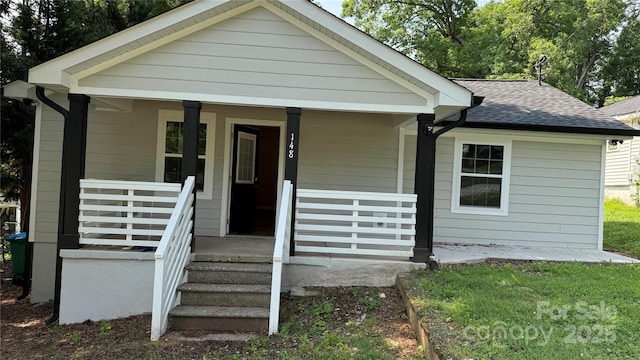 148 Forest Heights Dr, Mcadenville, NC 28101 - bungalow-style house with a shingled roof and covered porch