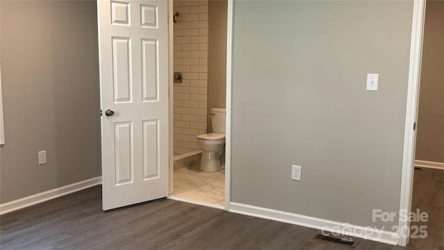 148 Forest Heights Dr, Mcadenville, NC 28101 - unfurnished bedroom featuring baseboards, dark wood-style flooring, and ensuite bathroom