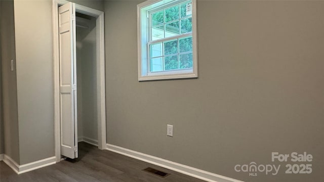 148 Forest Heights Dr, Mcadenville, NC 28101 - unfurnished bedroom featuring baseboards, dark wood-style floors, and a closet