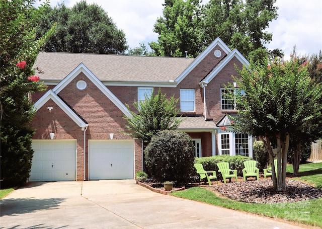 1012 Bancroft Ct, Fort Mill, SC 29707 - traditional home with brick siding, driveway, a shingled roof, and an attached garage