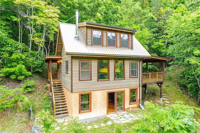 1146 Thomas Branch Rd, Marshall, NC 28753 - view of front of house with stairs, a view of trees, metal roof, and stucco siding