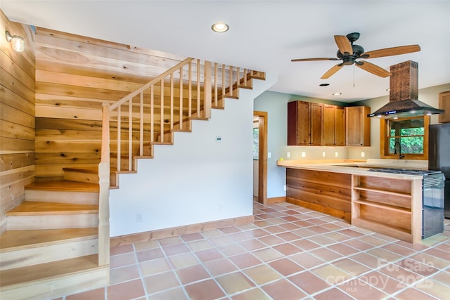 1146 Thomas Branch Rd, Marshall, NC 28753 - kitchen featuring island range hood, brown cabinetry, ceiling fan, recessed lighting, and baseboards