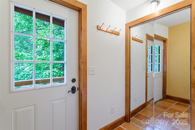 1146 Thomas Branch Rd, Marshall, NC 28753 - doorway with light tile patterned floors and baseboards