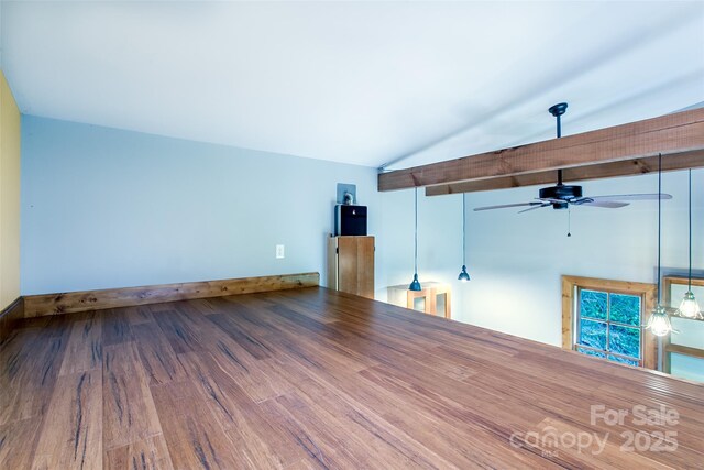 1146 Thomas Branch Rd, Marshall, NC 28753 - unfurnished living room with vaulted ceiling, ceiling fan, wood finished floors, and baseboards