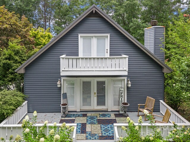 192 Shady Ln, Mill Spring, NC 28756 - view of front of property with a balcony, french doors, a chimney, and an outdoor living space