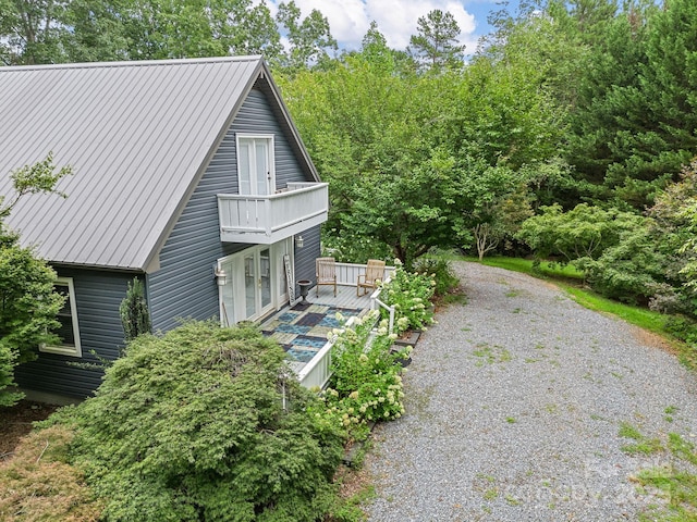 192 Shady Ln, Mill Spring, NC 28756 - view of property exterior featuring a balcony and a metal roof