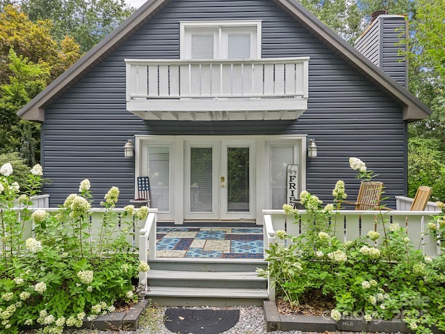 192 Shady Ln, Mill Spring, NC 28756 - back of property with a balcony, french doors, and a chimney