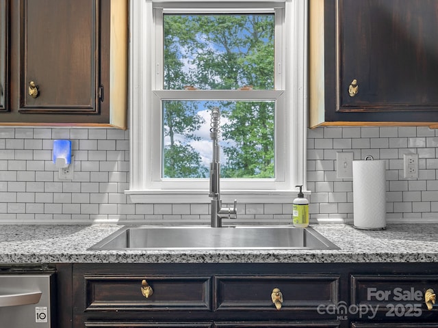 192 Shady Ln, Mill Spring, NC 28756 - kitchen featuring dark brown cabinetry and tasteful backsplash