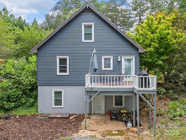 192 Shady Ln, Mill Spring, NC 28756 - back of property featuring a deck and a patio