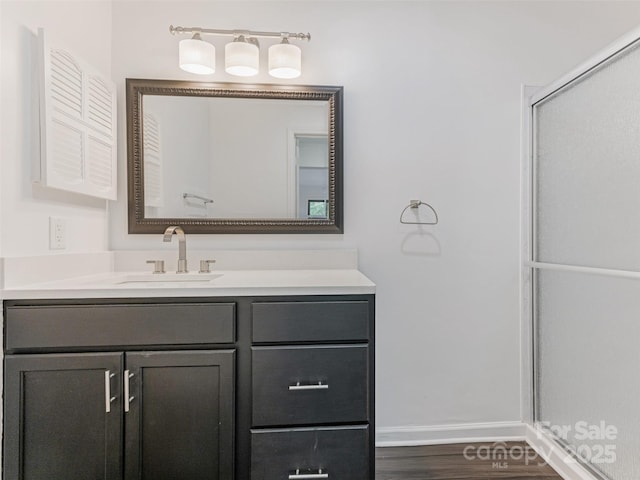 8183 Cedar Glen Dr, Charlotte, NC 28212 - full bathroom with vanity, a shower stall, baseboards, and wood finished floors