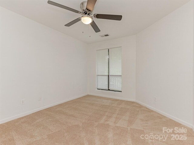 8183 Cedar Glen Dr, Charlotte, NC 28212 - spare room featuring light colored carpet, baseboards, and a ceiling fan