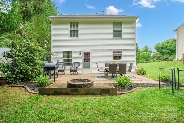 1912 8th St SE, Hickory, NC 28602 - back of house with an outdoor fire pit, a patio, and a lawn