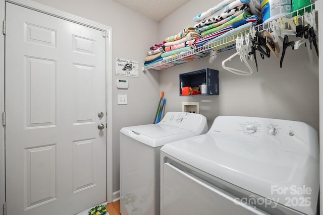 1912 8th St SE, Hickory, NC 28602 - laundry area featuring washer and clothes dryer and a textured ceiling