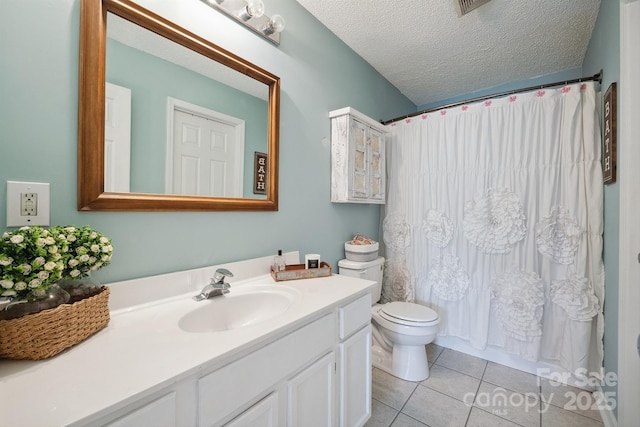 1912 8th St SE, Hickory, NC 28602 - bathroom featuring vanity, tile patterned floors, toilet, and a textured ceiling