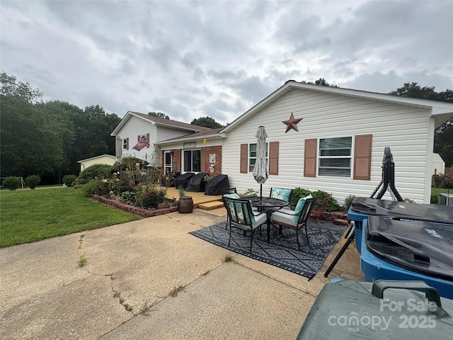 1895 Sandy Cir, Newton, NC 28658 - back of property with a yard, a patio, and a wooden deck