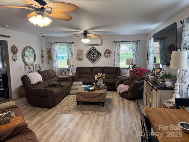 1895 Sandy Cir, Newton, NC 28658 - living room with a wall mounted air conditioner, ceiling fan, and light wood-style flooring