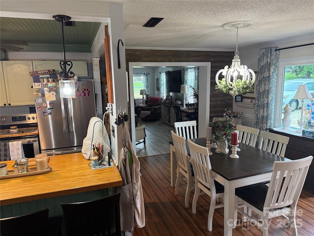 1895 Sandy Cir, Newton, NC 28658 - dining room with a chandelier, crown molding, dark wood finished floors, and a textured ceiling